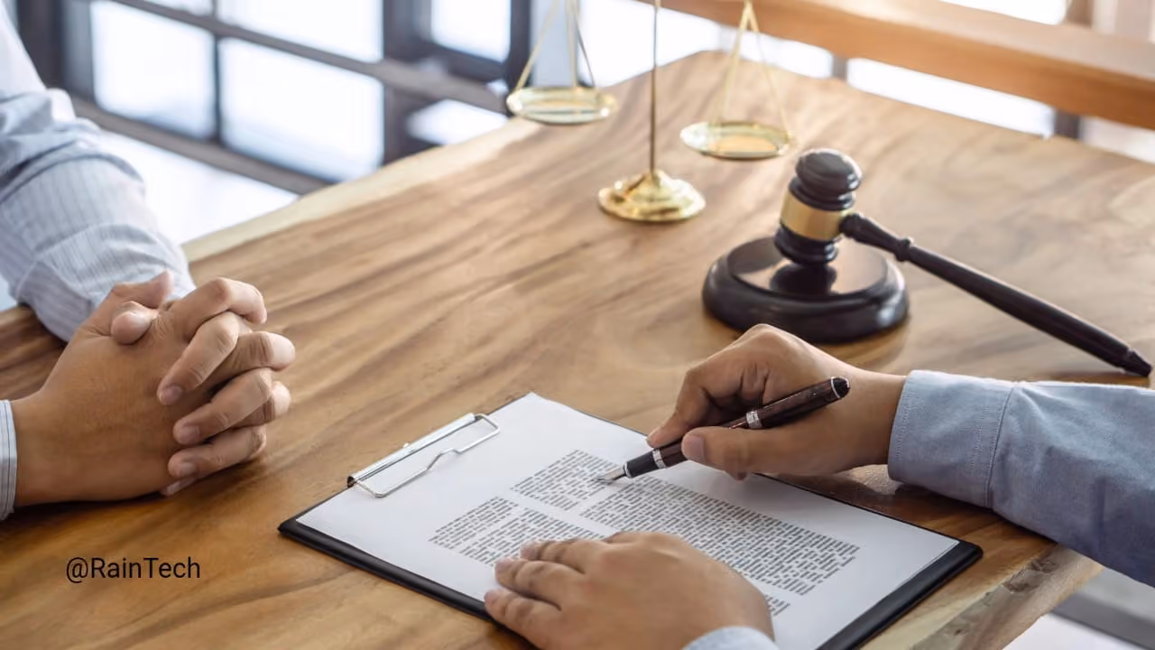 Hands reviewing a legal document with a gavel and scales of justice, illustrating EOR contract compliance.